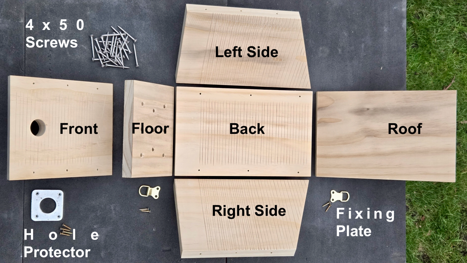 The eight components of the nest box laid out: front, floor, back, roof, two sides, hole protector and fixing plate